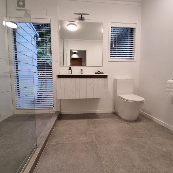 Completed modern bathroom renovation by Plumberz in West Auckland